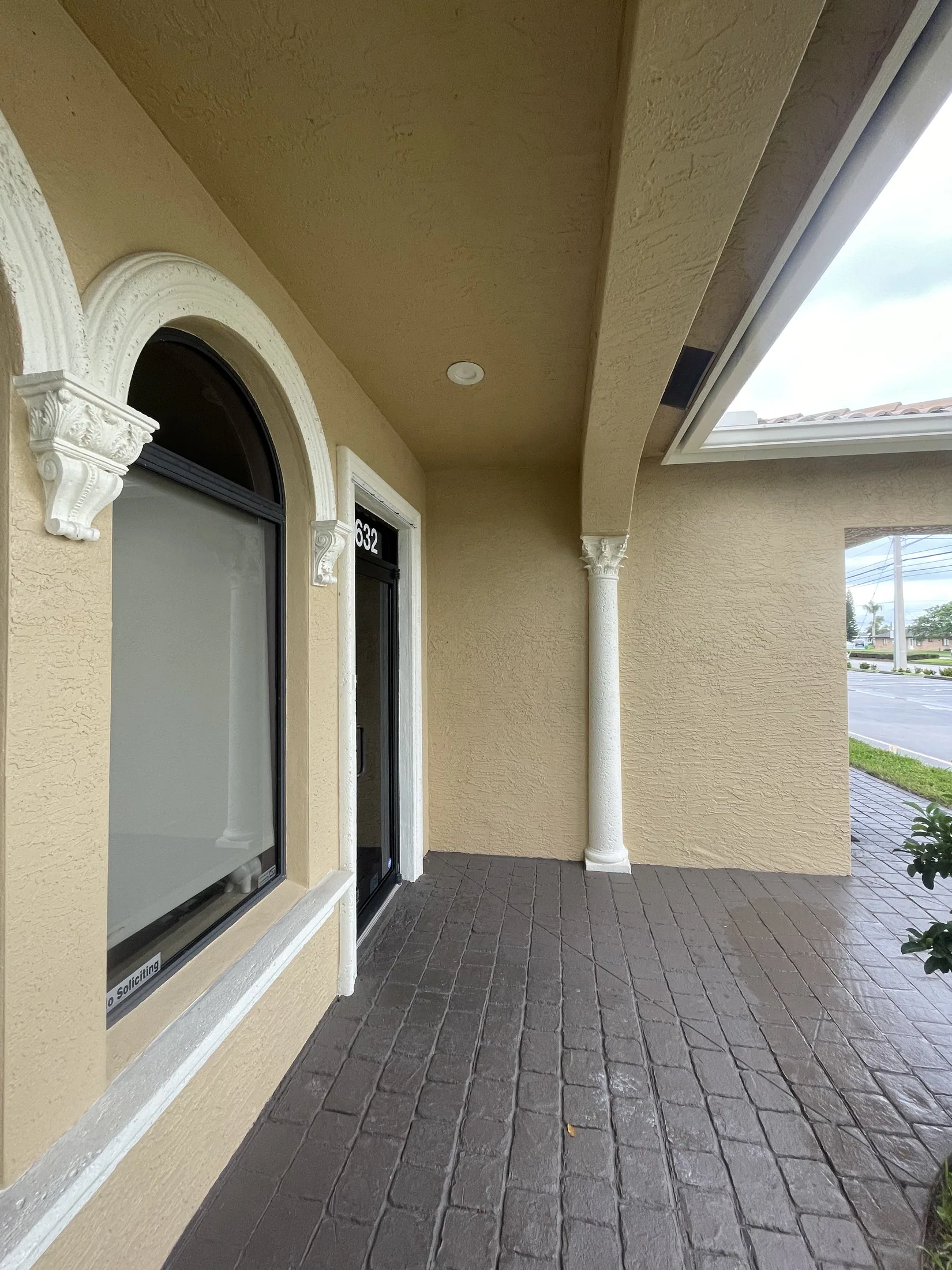 Covered entry with a paver walkway
