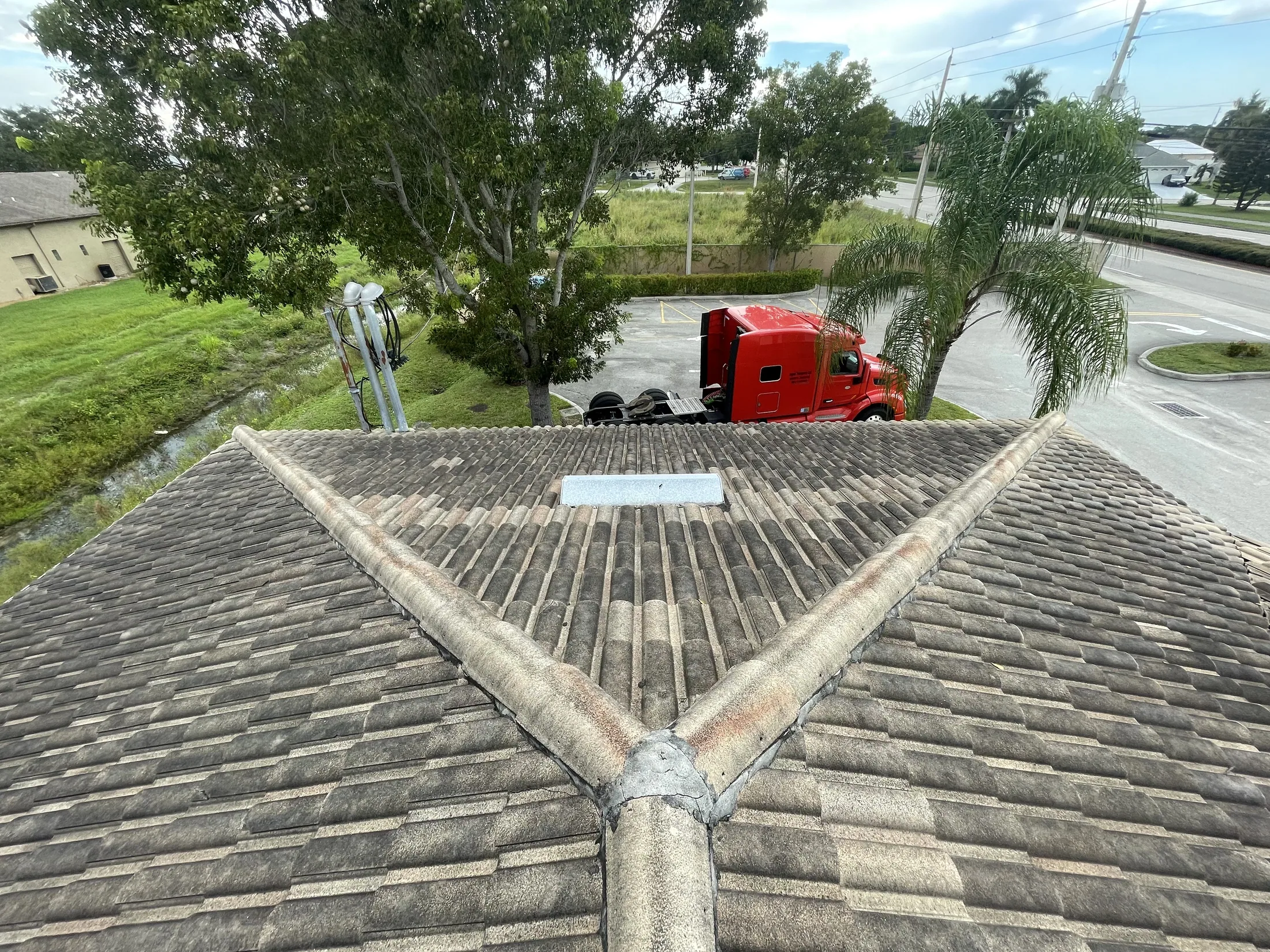 Close view of a gray tile roof valley