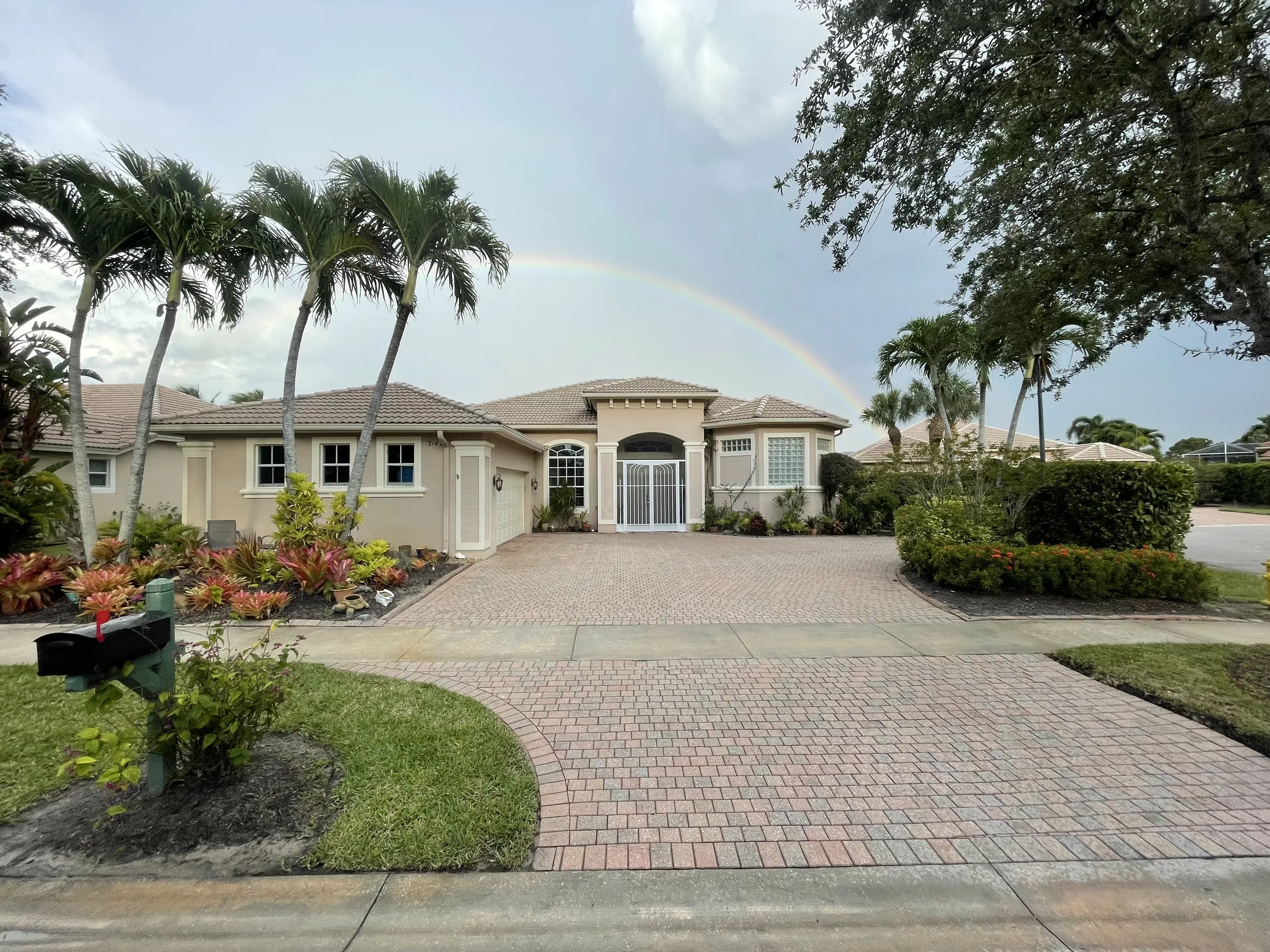 Large paver driveway in front of a home