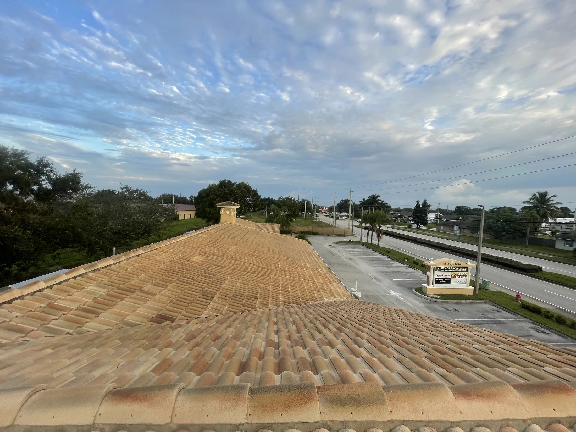 Tan tile roof at sunset after cleaning
